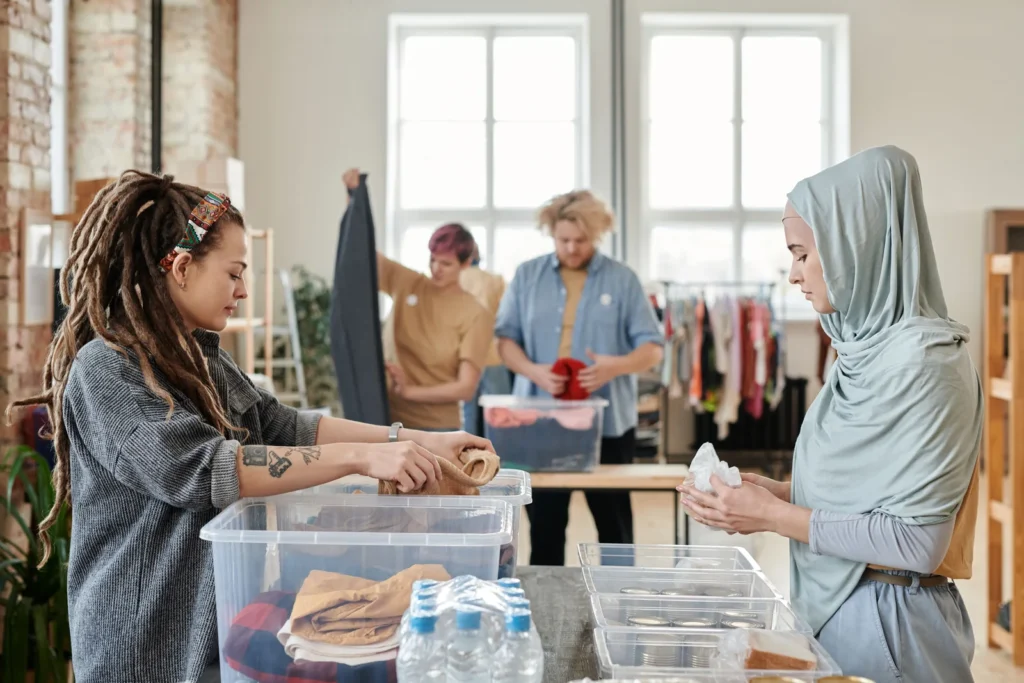 Volunteers sorting donated clothes together